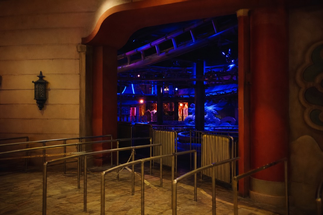 Indoor themed attraction entrance with dramatic colored lighting at Fuji-Q Highland