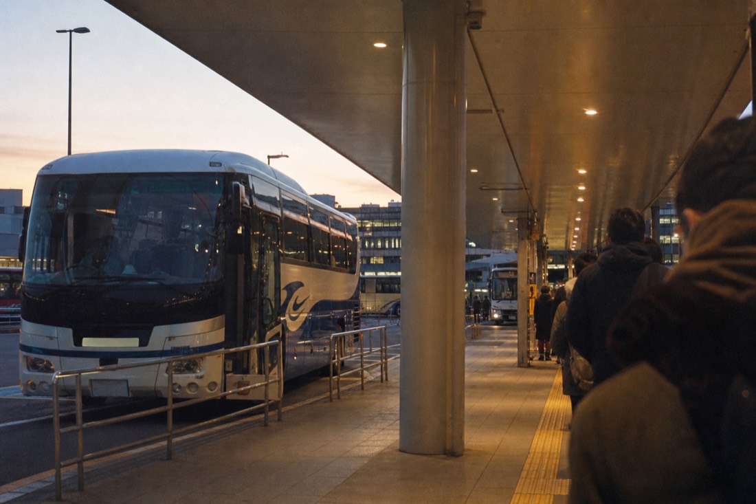 Highway bus waiting at a Tokyo terminal bay before the Fuji-Q run